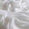 white textile on brown wooden table